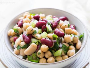 A three bean salad in a white bowl