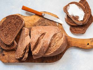 Homemade dark rye bread on a wooden board