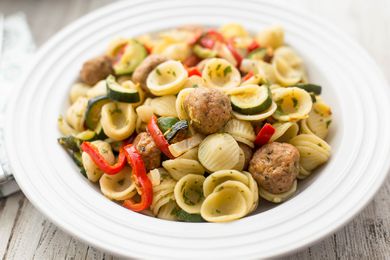 Pasta with Turkey Meatballs and Vegetables in a white dish