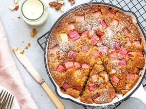 Almond Flour Cake Recipes - almond cake in skillet with cream nearby