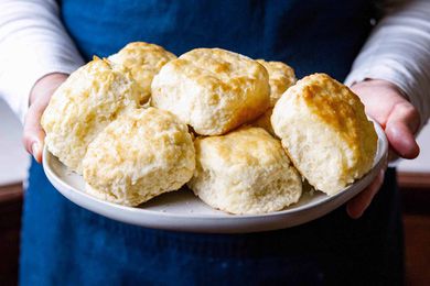 Southern Biscuits with White Lily Flour - hands holding a plate of biscuits