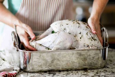 Setting dry brined turkey into roasting pan