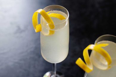 Fancy French 75 cocktail with champagne gin and simple syrup ingredients