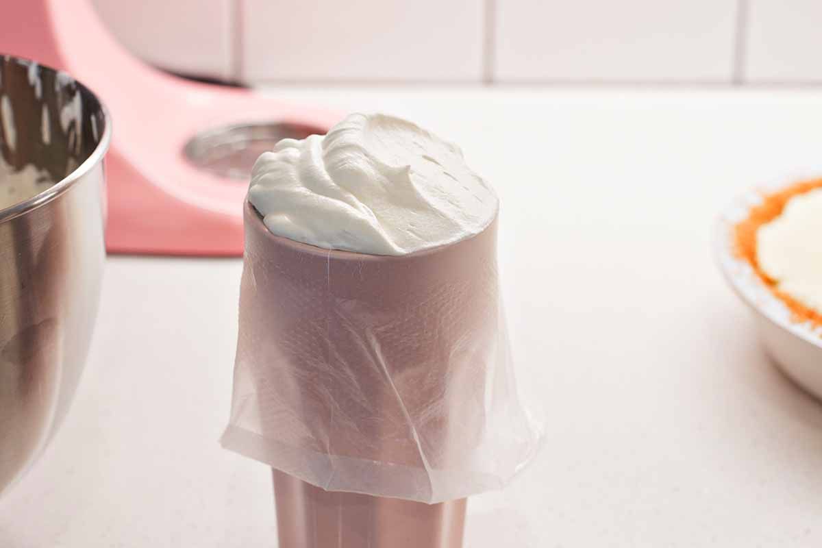 Piping bag full of whipped cream.