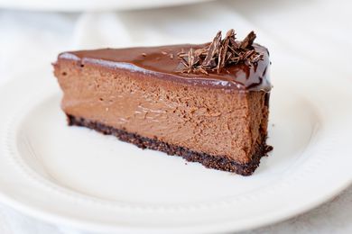 Chocolate cheesecake slice on a white plate
