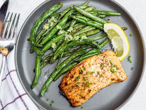Air Fryer Dijon Salmon with Charred Green Beans and a Lemon Wedge