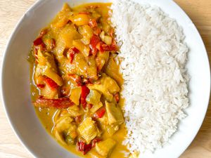 4-ingredient Trader Joe's chicken curry recipe served with jasmine rice in a bowl