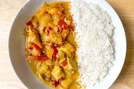 4-ingredient Trader Joe's chicken curry recipe served with jasmine rice in a bowl