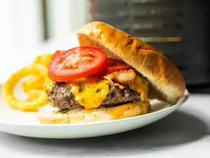 Air Fryer Burger on a Plate with Onion Rings