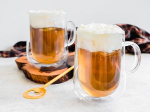 Mugs of Butterbeer Topped with Whipped Cream