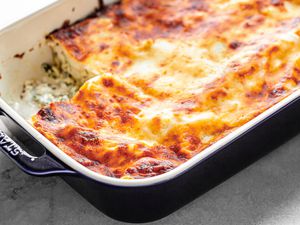 Chicken Lasagna in a Casserole Dish with a Slice Missing
