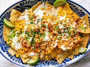 A platter of Mexican street corn nachos (elote)