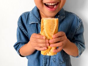 Kid with French baguette