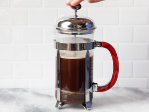 French Press Covered with Lid and Plunger Pushed Down for French Press Coffee Recipe 