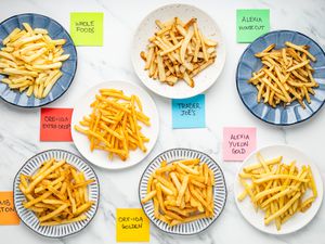 Plates of Cooked Fries With Post-It Labels on the Counter Next to Eat Plate