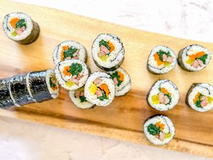Classic Kimbap on a Wooden Plaque