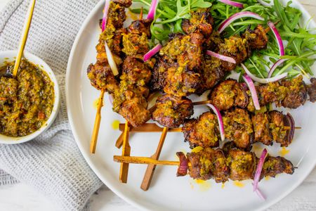 Plate of Lamb Skewers with Epis Served with Arugula