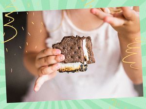 Person holding a chocolate s'more