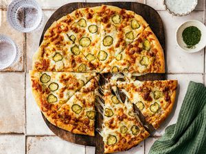 pickle pizza on a cutting board