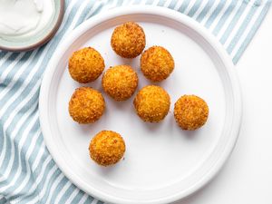 Potato Croquettes on a Plates on a Table Cloth