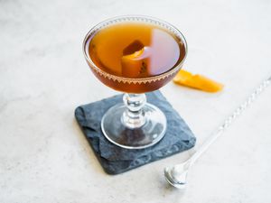 Rob Roy in Cocktail Glass on Top of Granite Coaster