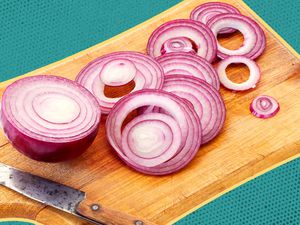 red onions on a cutting board
