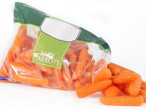 An open bag of baby carrots