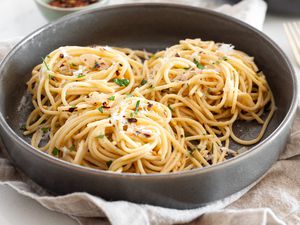 Spaghetti Aglio e Olio (Pasta With Garlic and Oil) Topped with Parsley and Parmesan