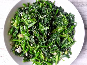 Toasted sesame and garlic spinach in a white bowl.