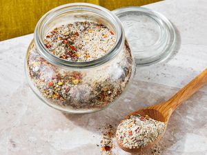 Jar of Steak Seasoning Next to a Spoonful on the Counter