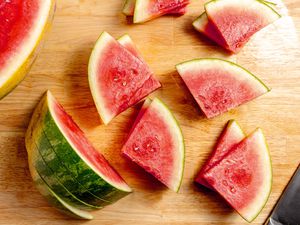 Watermelon in the process of being cut into triangles