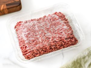 Frozen Ground Beef in a Plastic Wrapped Meat Container
