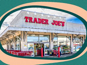 Photo of Trader Joe's Storefront With Fun Green and Orange Illustrations Around the Photo