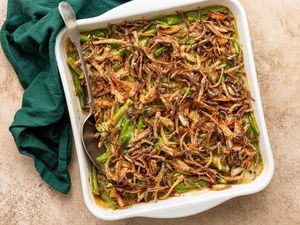 Casserole Dish of Vegan Green Bean Casserole with a Spoon and Next to a Table Napkin