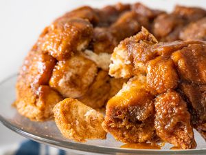 Monkey Bread on a Cake Stand with Pieces of Bread Broken Off 