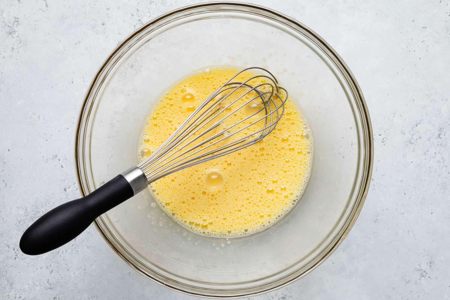 Bowl of Eggs Whisked Until Frothy for Sad Cake Recipe